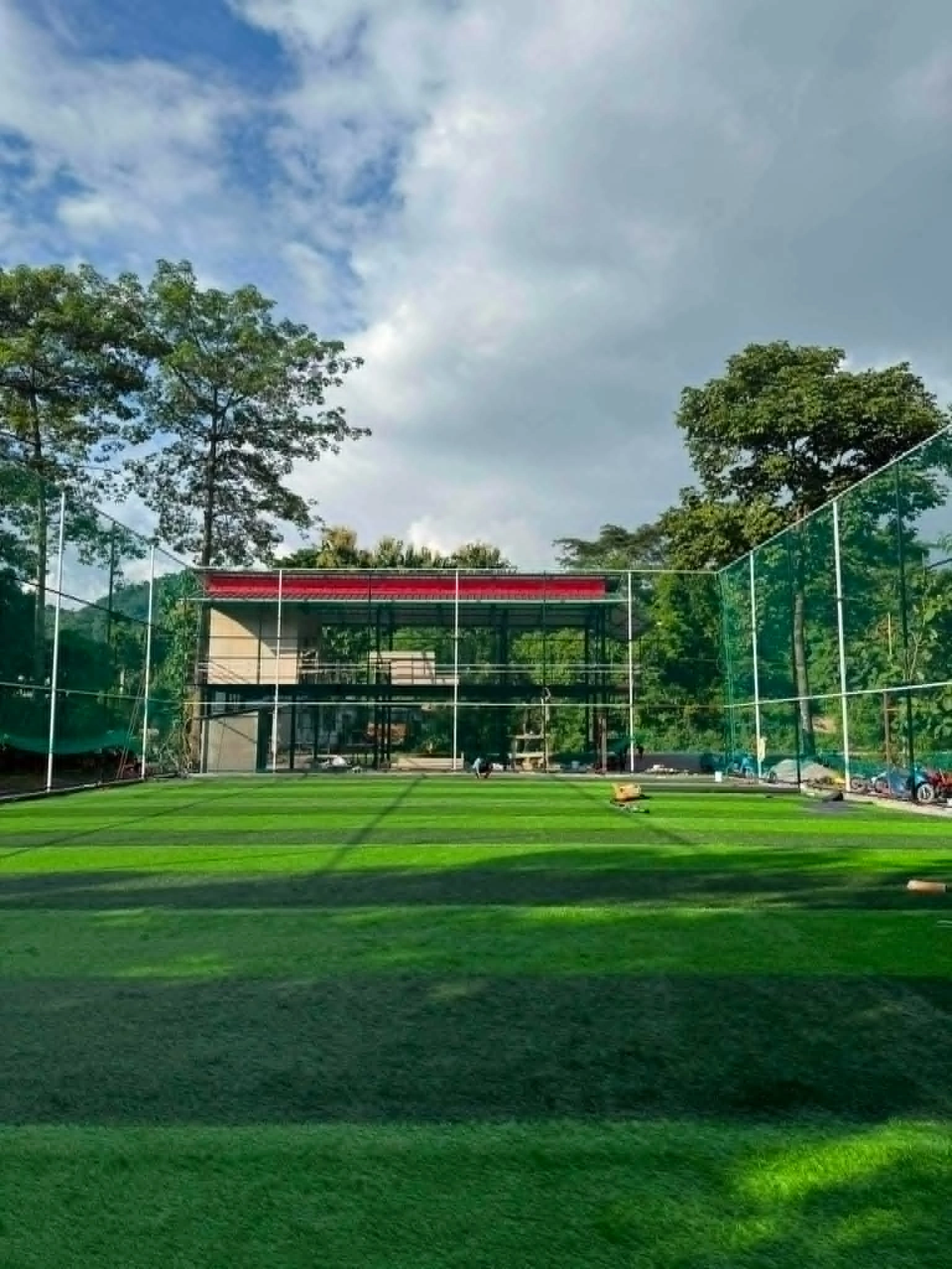 The pitch at Greenland Futsal, full-size turf under four floodlight masts
